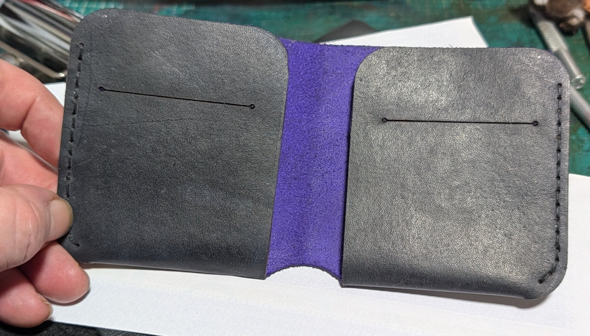 Alt Tag: Compact Bi-Fold Wallet handmade in Black open view showing slim leather interior card slots and bi-fold design