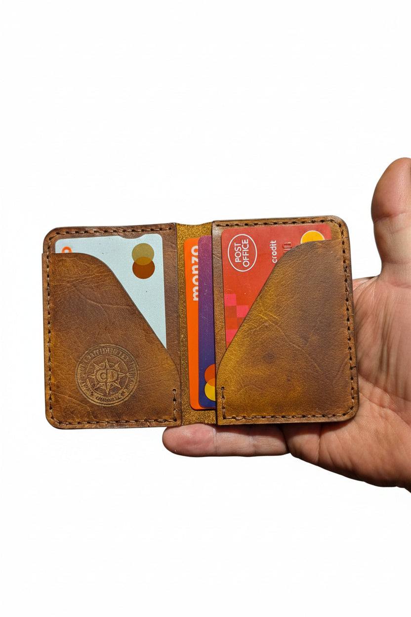 Devonport black full-grain leather bi-fold wallet with four card pockets