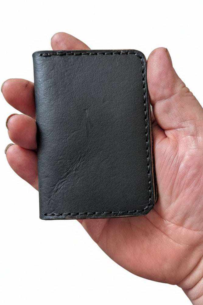 black Devonport bi-fold wallet made from full-grain vegetable-tanned leather