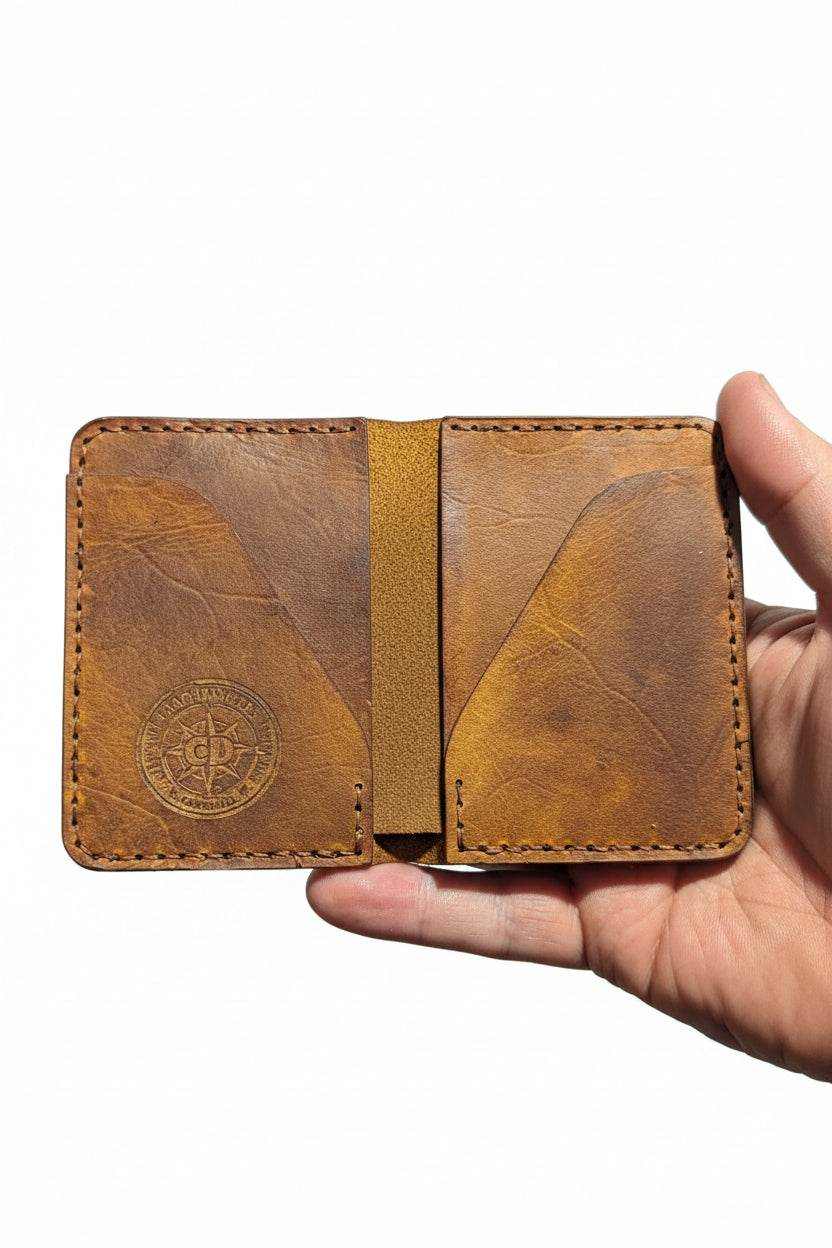 Devonport black full-grain leather bi-fold wallet with four card pockets