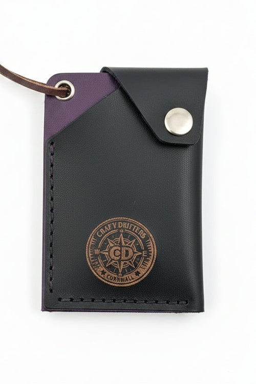 Compact flap top card holder holding multiple cards and notes for organized daily carry