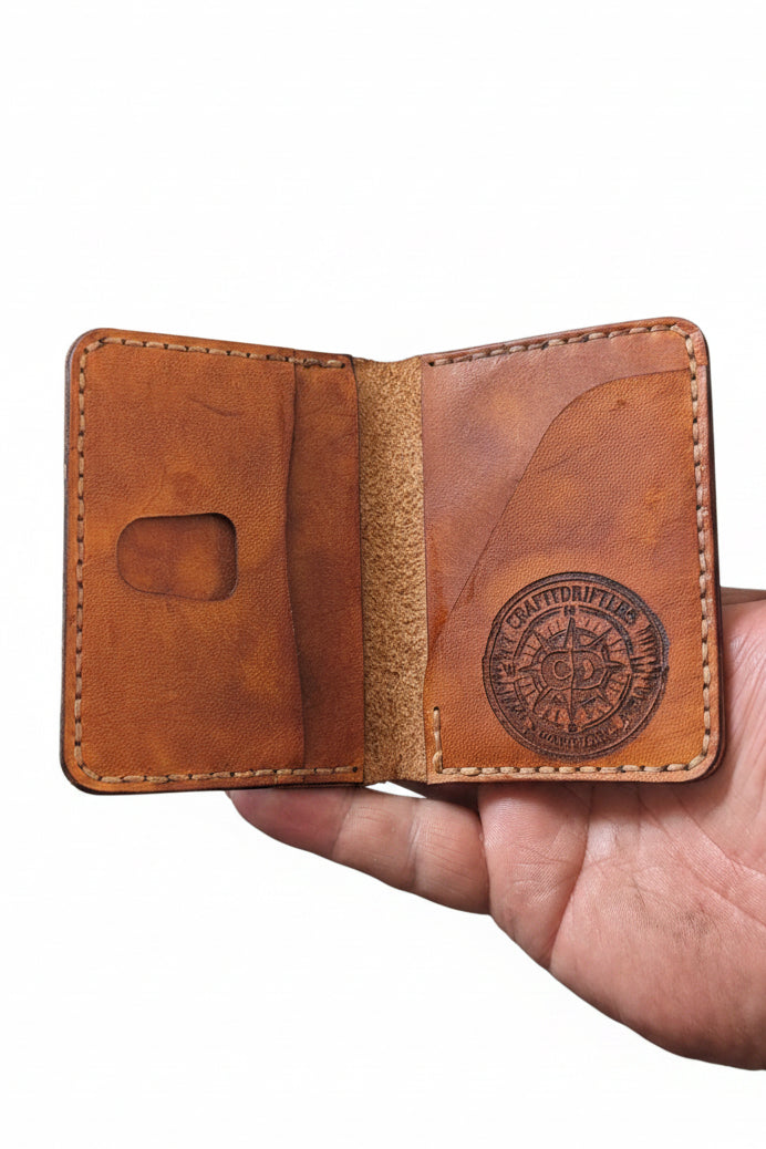The Devonport low profile handmade bi-fold leather wallet made from hand dyed full-grain leather with a slim design and multiple card slots