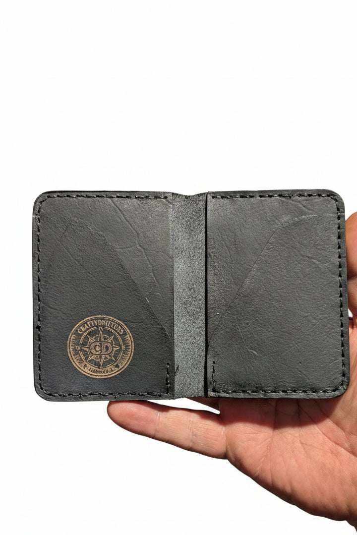 Devonport black full-grain leather bi-fold wallet with four card pockets