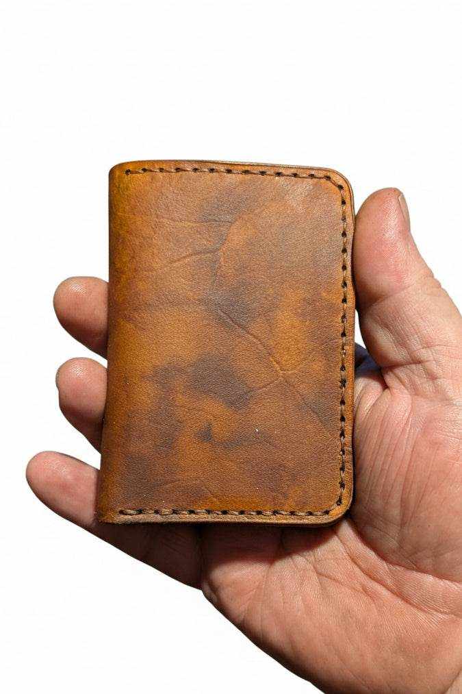 Devonport black full-grain leather bi-fold wallet with four card pockets